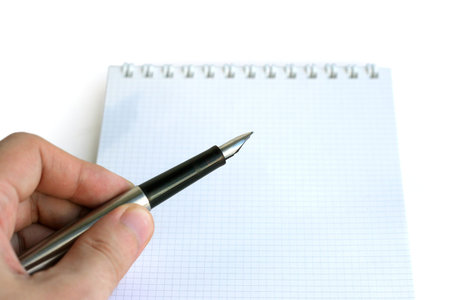 Hand, Pen and Note on whiteの写真素材