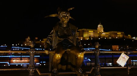 Night scene of the Little Princess statue by Danube with Buda Castle in the backgroundの写真素材