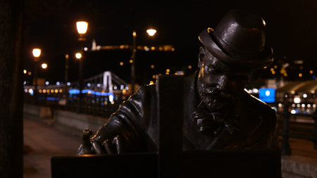 A detail of bronze statue of famous hungarian painter Roskovics Ignac in Budapest, night sceneの写真素材