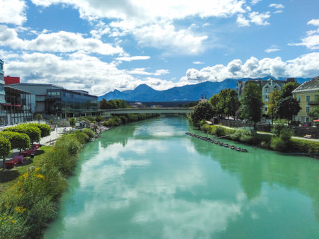 Beautiful turquoise Drau River runs through Villach town center, Austriaの写真素材