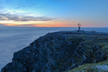 The sunset over a globe on North Cape, Nordkapp, Norwayの写真素材