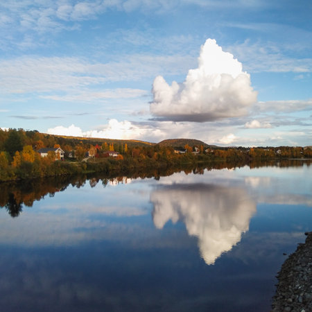 The scenery of Karasjok village and Karasjohka river with big cloud reflected in it, Norwayの写真素材