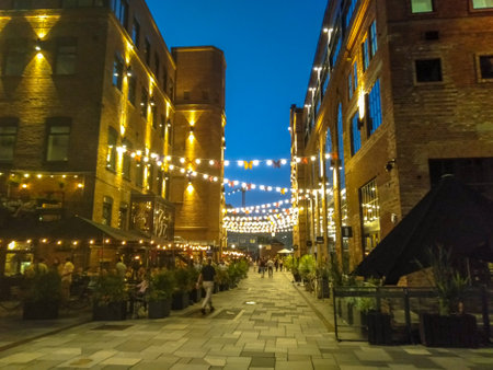 Illuminated Akker Brygge, a modern district in Oslo city center at night and in the rain, Norwayの写真素材