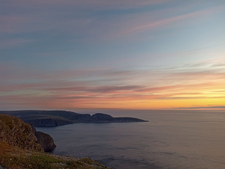 The view from the North Cape of the sunset over Knivsjelloden Cape, Norwayの写真素材