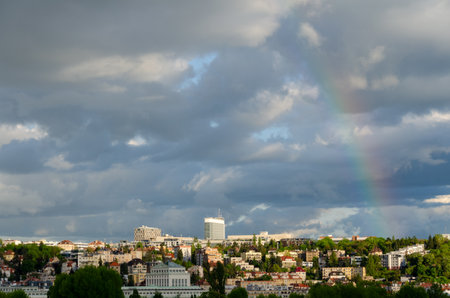 Cloudy sky and a rainbow over Pankrac, a modern district with skyscrapers in Prague, Czech Republicの写真素材
