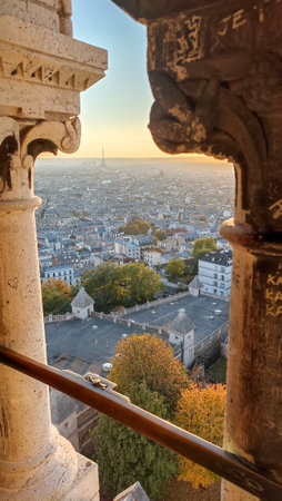 A panoramic view of Paris, France with the Eiffel Tower from the dome of the Sacre Coeur Basilica during the sunsetの写真素材