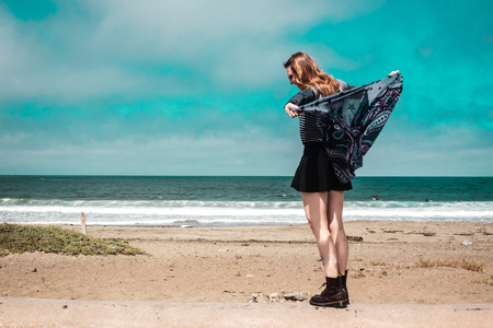 Photo of Pretty Girl walking in front of the Beach in Californiaの写真素材