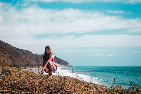 Photo of Girl and Oceanview from California Coast, United Statesの写真素材