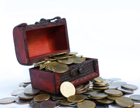 Open Treasure Chest Filled With Gold Coins On Pile Of Gold Coins Close Up