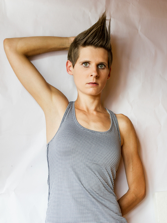 Sporty young woman against a white backgroundの写真素材