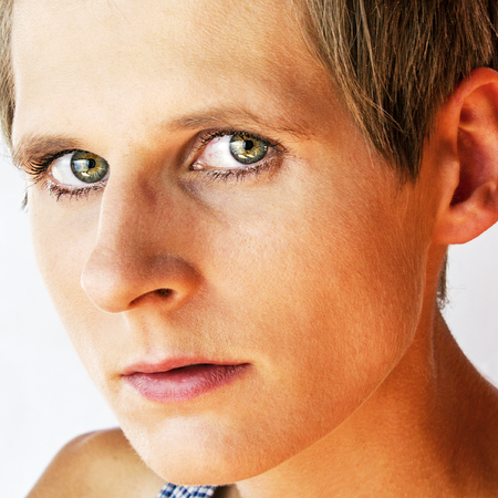 Portrait of a young woman with green eyesの写真素材