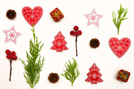 Christmas composition. Christmas gifts, pine branches, toys on white background. Flat lay, top view.の写真素材