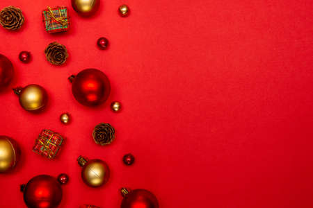Holiday Christmas background. Festive composition for the Christmas and New Year holiday season. Christmas decorations with copy space on red background.の写真素材