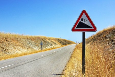 Roadsign on the inclined road.
