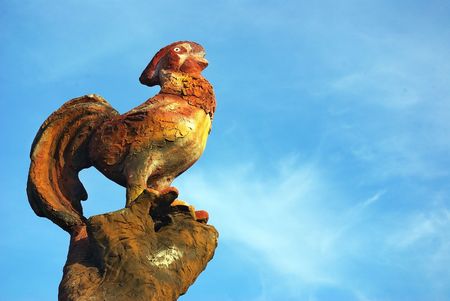 Rooster in a wooden post.の写真素材