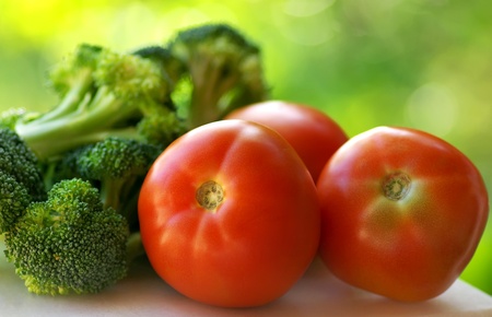 Broccoli and mature tomato.の写真素材