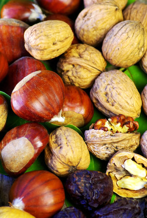 Assortment of nuts displayed on wood background 