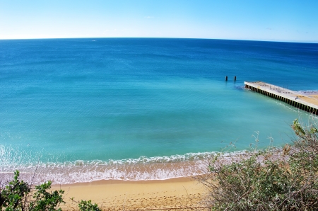 Blue sea in bay at Portugalの写真素材