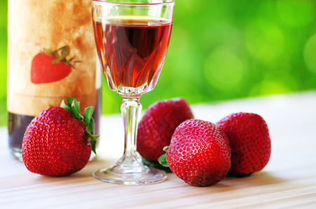 A Bottle and glass of  Raspberry Liqueurの写真素材