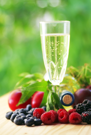 blueberries, blackberry,raspberry and wineglassの写真素材