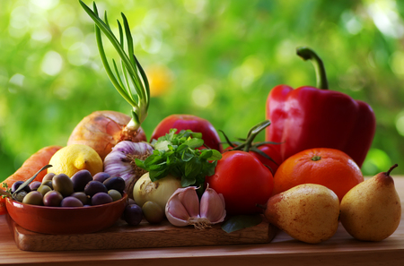 Fresh fruits and vegetables on tableの写真素材