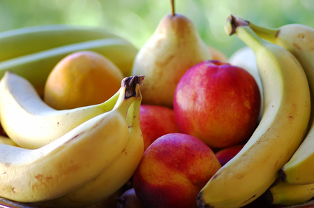 bananas, pear and peaches, ripe fruitの写真素材