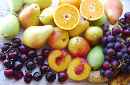 ripe fruits close-up on wooden tableの写真素材