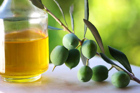 green olives and olive oil bottleの写真素材