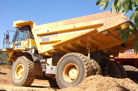yellow truck at a construction siteの写真素材