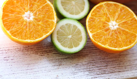 slices of citrus fruit on wooden tableの写真素材