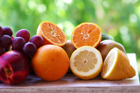 peaches and grapes, orange and lemon slicesの写真素材