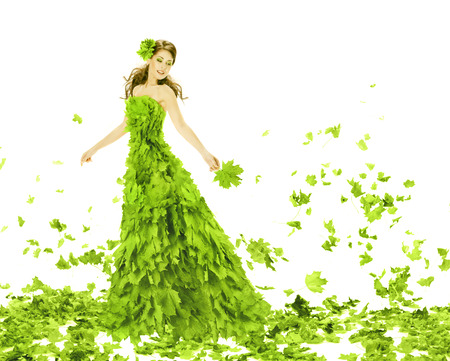 Fantasy beauty, fashion woman in seasons spring leaves dress. Creative beautiful girl in green summer gown, over white background.
の写真素材