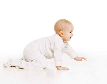 Toddler Crawling in White Baby Onesie, Active Kid Creeping over White Backgroundの写真素材