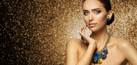 Fashion Model Makeup Portrait, Elegant Woman in Necklace Jewelry touching Face, Beautiful Slim Lady Make Upの写真素材