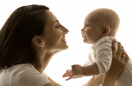 Mother and Baby, Mom Looking to Newborn Child Face to Face, Happy Kid Six Months Oldの写真素材