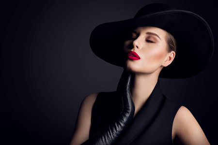 Woman Beauty in wide brim Hat, Elegant Fashion Model Retro Portrait on Black
