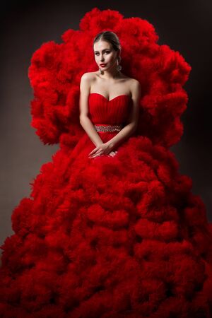 Fashion Model art Red Dress, Woman Beauty portrait, Beautiful Queen in Waves Cloth Gownの写真素材