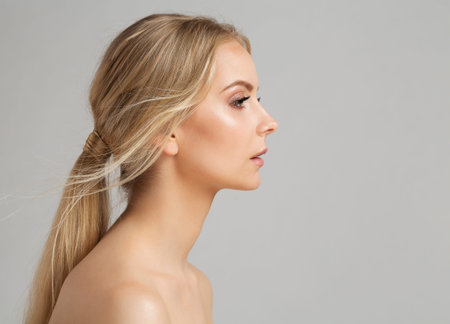 Woman Face Profile. Young Girl Portrait with Smooth healthy Skin. Model Facial Side View over Gray....