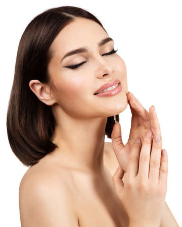 Beauty Model Face Skin Care Cosmetics. Woman with Eyeliner Make up on closed Eyes over isolated White. Women Nail Manicure and Facial Plastic Surgery. Spa Massage and Face Lift Cosmetologyの写真素材