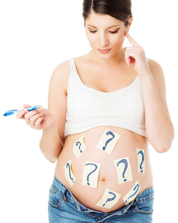 Pregnant Woman thinking about Pregnancy Development and Child Birth. Future Mother asking Questions about Prenatal Health Care. Parent choosing Baby Name. Writing Checklist to Nursery Clinic Bagの写真素材