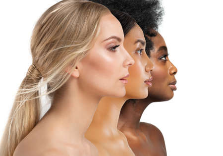Beauty Diversity Faces. Multi Ethnic Women Caucasian, African and Asian. Three Woman Profile with different Skin Type and Color over White Isolated. Facial Care Cosmetics and Make upの写真素材