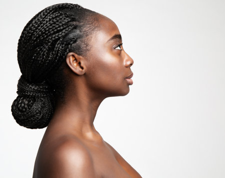 African Braids Hairstyle. Afro Hair Braided. Beauty Woman Face Profile. Dark Skin Care and Cosmetology. Fashion Model Side view Portrait isolated Whiteの写真素材
