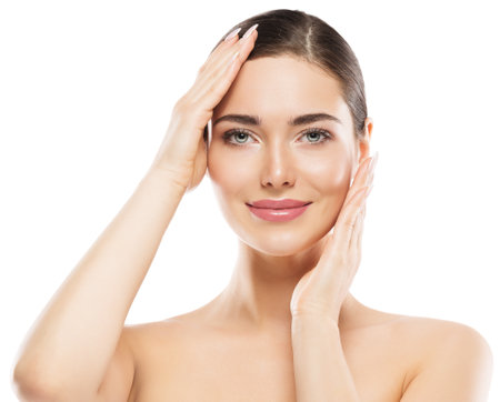 Woman Face Skin Care. Beauty Girl with plump Lips natural Make up. Beautiful Happy Model Portrait over White. Facial Spa Massage and Plastic Surgery Salonの写真素材
