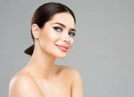Happy Beauty Woman. Beautiful Girl with perfect natural Lips Makeup. Women Smooth Face Skin and Body Care. Spa Cosmetologyの写真素材
