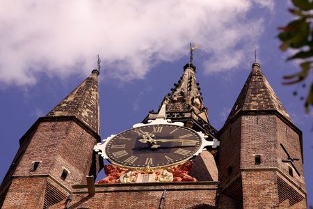Close-up of the clock at an old church towerの写真素材