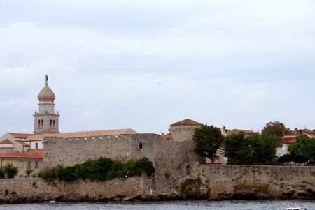 the city of Krk in Croatia with the old city wallsの写真素材