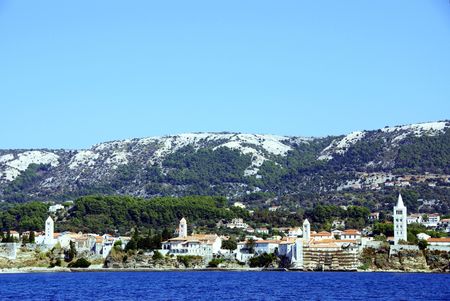 The four bell towers of Rab town at Rab island in Croatiaの写真素材