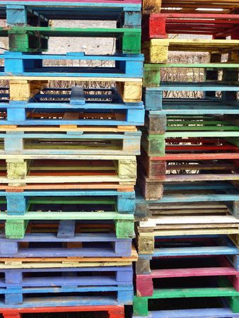 Piles of colorful wooden palletsの写真素材