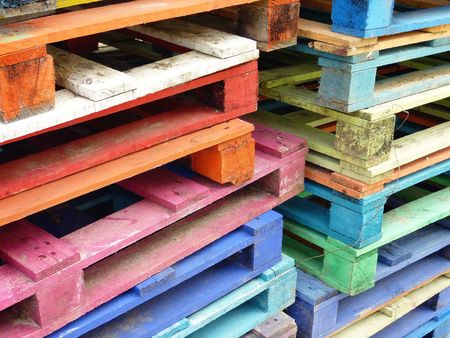 Piles of colorful wooden palletsの写真素材