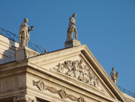 The top of the neo classical front of the national theatre Donna Maria II in Lisbon in Portugal